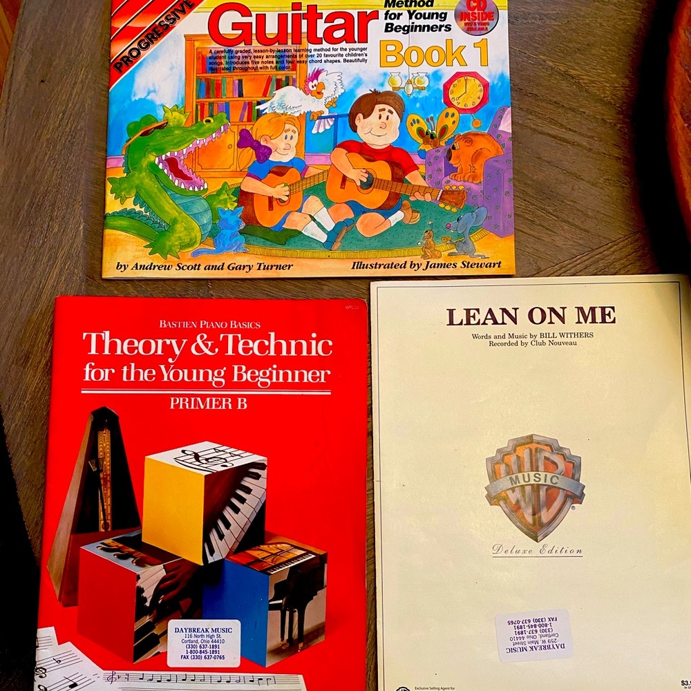 Three beginner music books.